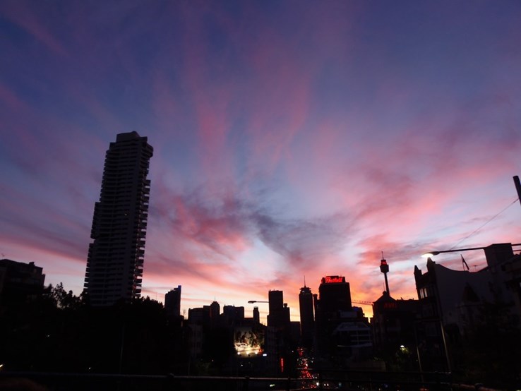 The sun goes down over the Sydney skyline ...